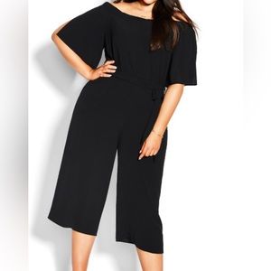 New with tags fun black jumpsuit great for the holidays .